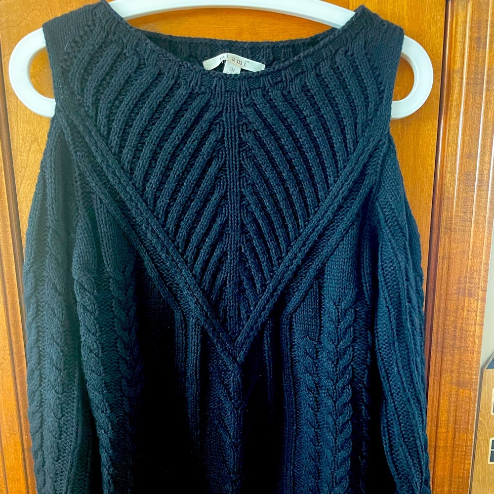 Cute cable knit off the shoulder sweater in black.
